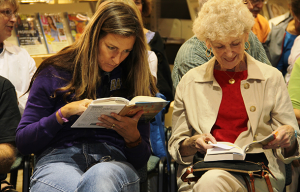 Two Women in Audience Reading