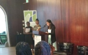 Three students Anastasia Farley, Maia Washington, and Cin'Shea Williams from the Writers in Baltimore Schools program providing remarks at the One Maryland One Book author reception.