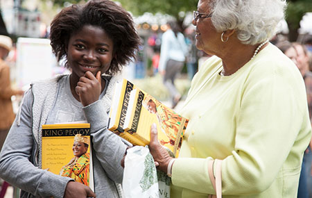 Girl in Line with Book