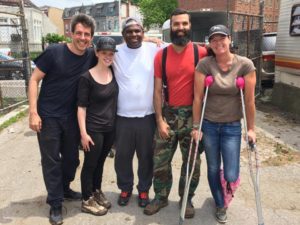 Volunteer cleanup day at the Arabber Yard. Left to right: Holden Warren (VP of the Arabber Preservation Society) Sydney Jenkins (secretary of APS), Jame Chase (Arabber and President of APS), Seth Wheeler (resident carpenter and fix-it guy), and Deloise Nobel-Strong (Treasurer of APS). Photo Credit: Deloise Nobel-Strong