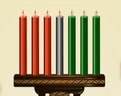 A Kwanzaa kinara (candle holder) with three red candles, one black candle, and three green candles, representing the seven principles of the holiday.